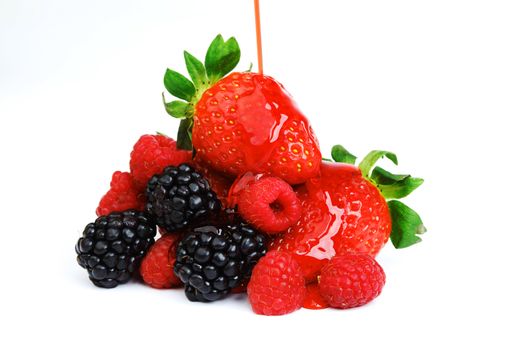 big berry pile in syrup isolated on white