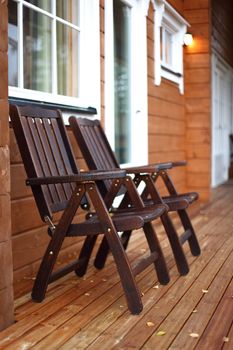 wooden armchairs in counry house