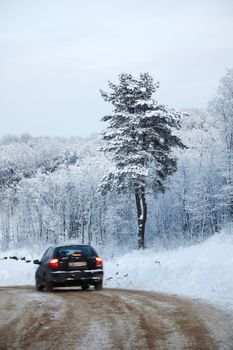 car on winter road blur in motion