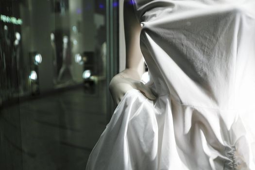 showcase with white clothes