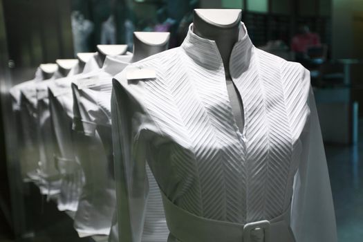 showcase with white clothes
