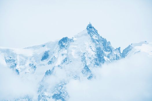 top of mountains in blue sky