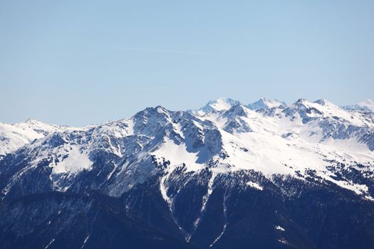 top of mountains sun in blue sky