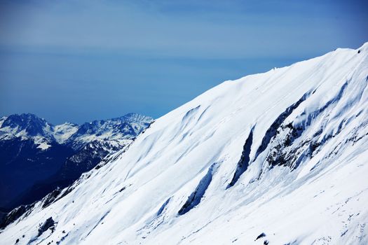 top of mountains sun in blue sky