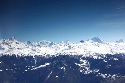 top of mountains sun in blue sky