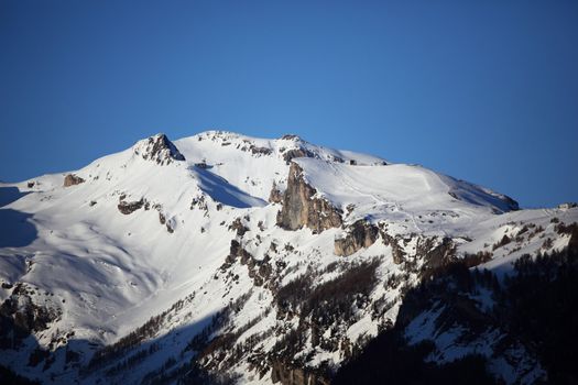 top of mountains sun in blue sky