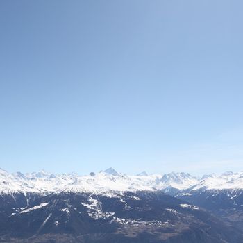 top of mountains sun in blue sky