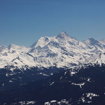 top of mountains in blue sky