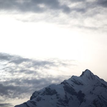 top of mountains sun in blue sky