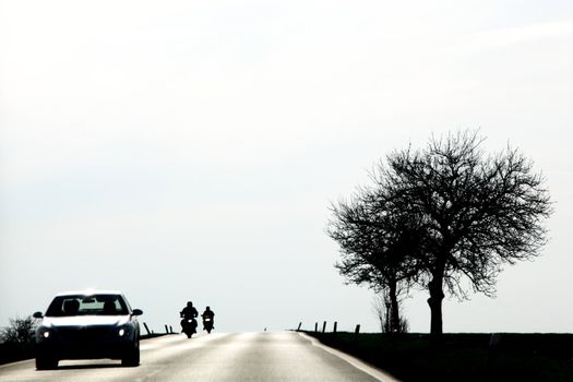 warm road car and bike silhouette
