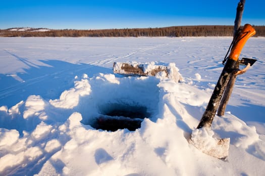 Hole for Ice-fishing through lake ice.