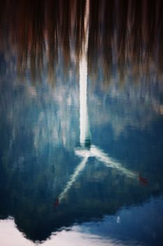 windpower mill reflect in water