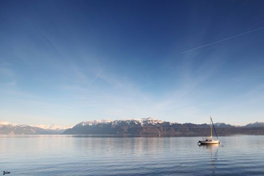 yacht in lake of geneva landscape on sunrise