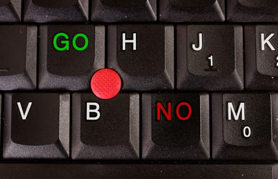 Close-up of laptop keyboard, with GO and NO buttons