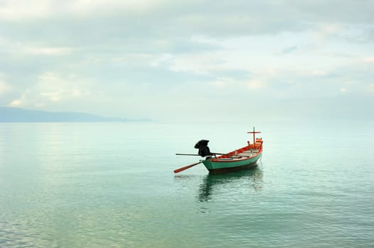 Traditional thailand boat  in the sea at sunrise