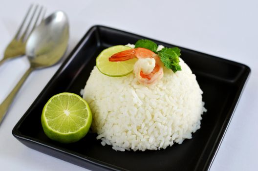 steamed rice served with fresh lemon and shrimp , waiting food