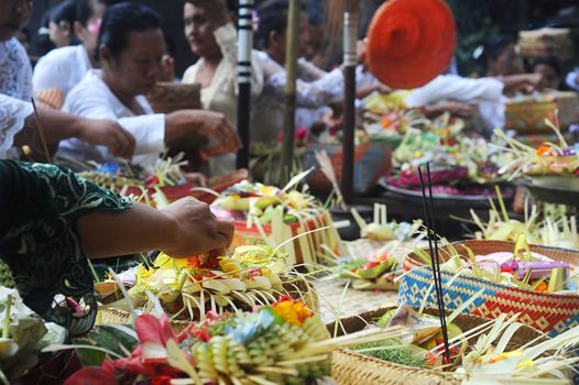 Ubud, Bali island, Indonesia - April, 06, 2011: Unidentified local people wearing in traditional indonesian clothes take part in Buda Wage Kelawu ceremony at Hindu temple.