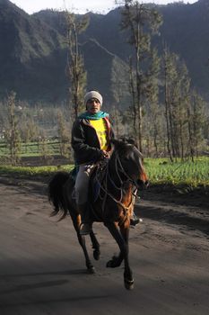 Probolingo, Indonesia - April 23,2011: Unedentified  Indonesian man riding horse.