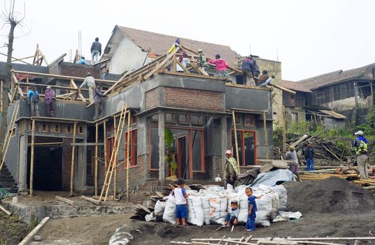 Sukapura, Indonesia - April 23, 2011: Construction activity of a building in small Indonesian village