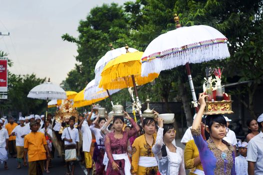 Ubud, Bali island, Indonesia - April, 29, 2011: Unidentified local people wearing in traditional indonesian clothes take part in Wayang Ceng Blonk ceremony .