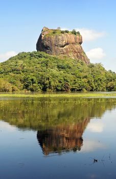 Sigiriya (Lion's rock) is an ancient rock fortress and palace ruin of Sri Lanka, surrounded by the remains of an extensive network of gardens, reservoirs, and other structures. A popular tourist destination, Sigiriya is also renowned for its ancient paintings