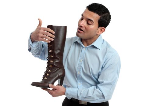 A store salesman showing a women's leather lace up boot.  White background.