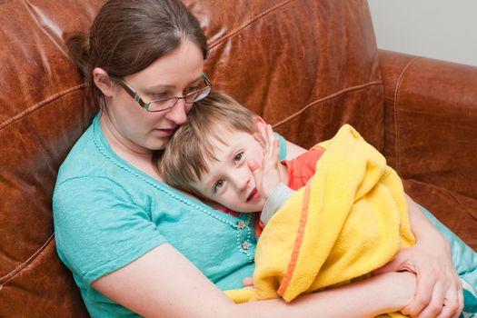 Mum and Child cuddling on the sofa