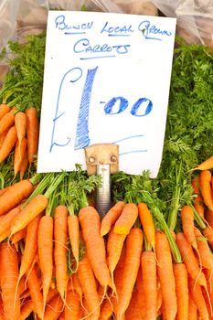 Locally grown carrots at an english market