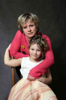 Portrait mum with a daughter in studio