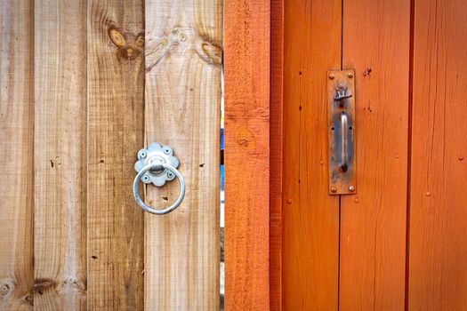 Two neighbouring garden gates in different tones and different styles