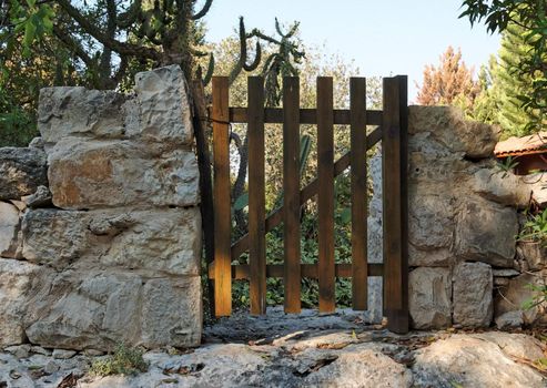 Small wooden wicket or gate of Mediterranean house