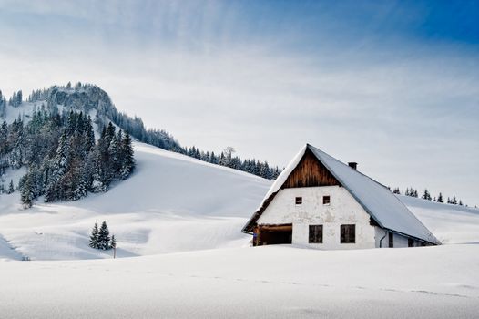 Winter idyllic with small hut in the austrian alps