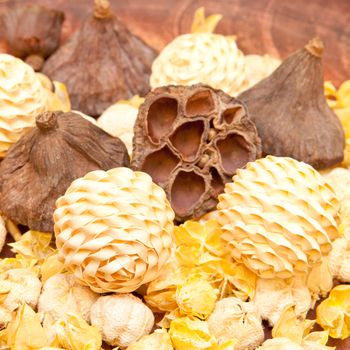 Selection of dried pot pourri on a wooden surface