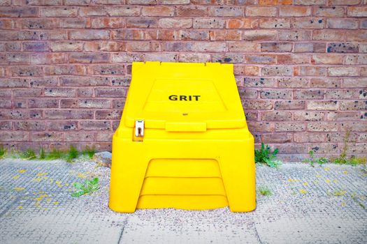 Yellow crate containing salt for de-icing roads in the cold weather