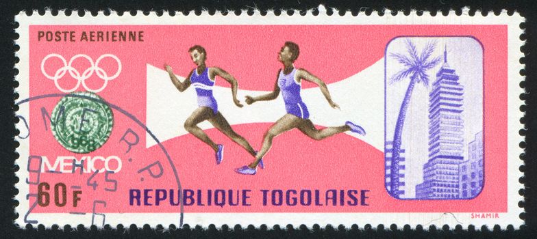 TOGO - CIRCA 1967: stamp printed by Togo, shows Mexico, Olympic emblem, runners, circa 1967