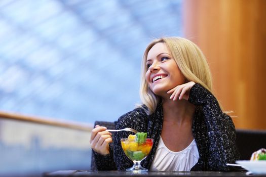 woman eat desert in caffe