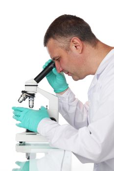 Scientist looking into a microscope in a laboratory