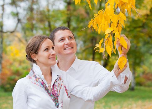 Portrait of romantic happy young beautiful couple on autumn walk