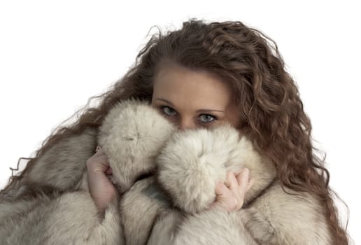 a young girl hiding in the fur