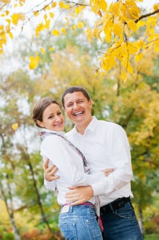 Portrait of romantic happy young beautiful couple on autumn walk