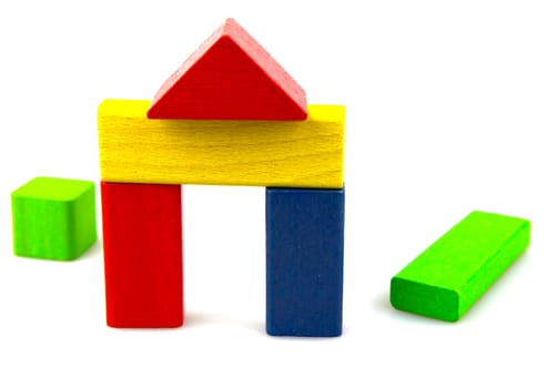 Wooden building blocks isolated on white background