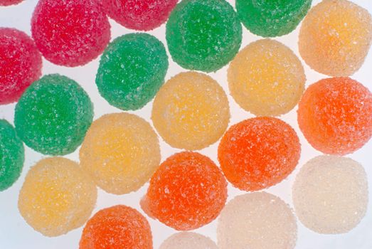 Macro up view of gelly sugar candy on white bright background.