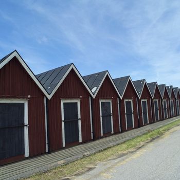 Row of boathouses on a sunny day