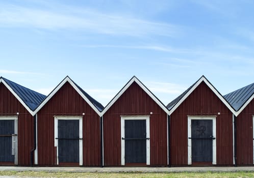 Row of boathouses on a sunny day