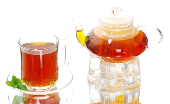 Tea being poured into glass tea cup