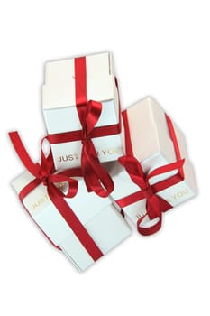 three white gift boxes with red ribbon for valentines day and love gifts with clipping path