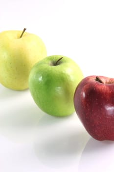 three apples yellow, green and red isolated diet healthy food and agriculture concepts
