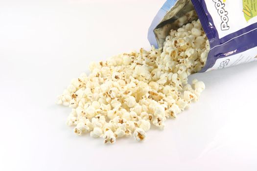 bag full of pop corn on white background food concepts