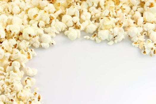 border from pop corn closeup with copy space  food and entertainment conceps