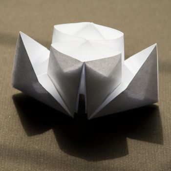 Paper steamship - simple origami on a black background